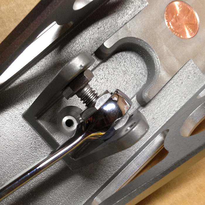 A bolt and a connector nut are used to spread the uprights if needed.